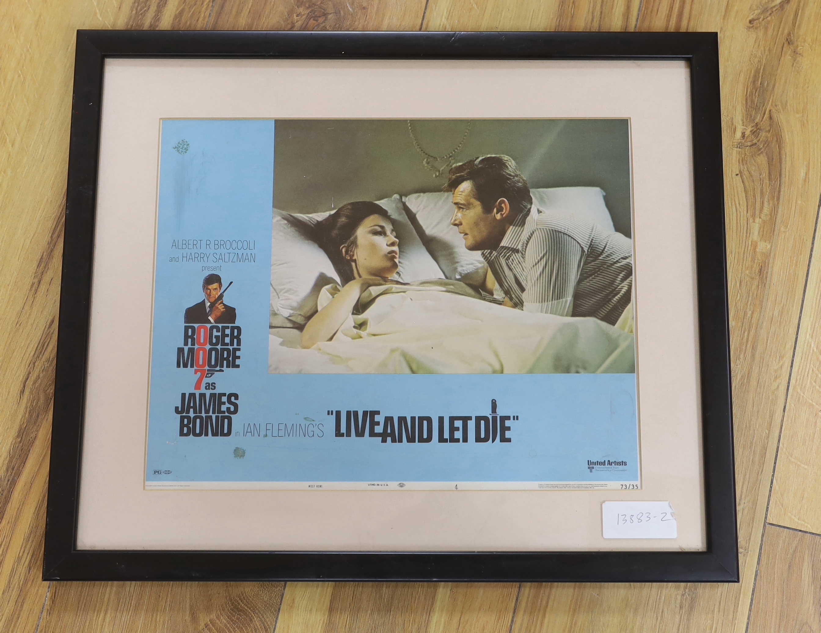 A James Bond 007 Live and Let Die framed original film lobby card, colour lithograph dated 1973 and ‘Litho in U.S.A.’ along bottom edge, frame 39.5cm x 47.5cm